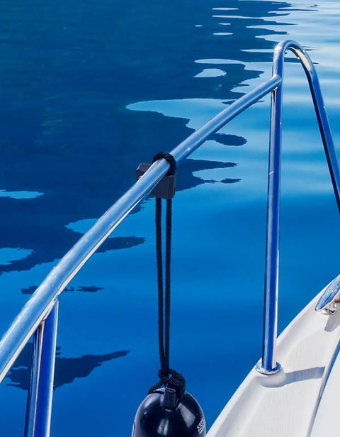 Boat Fender Clips Quick Release Adjustable Bumper Clips for Boats attached to rail, holding a fender above water surface