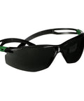 Top Tier Sport Safety Glasses Featuring Ir Five Gray Optics And Recessed Temple Ribs For Knockout Comfort And Seamless Ppe Compatibility On Heavy Duty Work Sites, black frame with green accents.