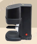 Straight Up Professional 58mm Electric Coffee Tamper featuring Hella Precise Digital Pressure Control, black countertop appliance.
