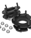 Level Up Your Whip With This Solid 2 Inch Front Suspension Lift Kit Featuring Durable Black Powdercoated Upper Mount Spacers. Close-up of black lift spacers and nuts.