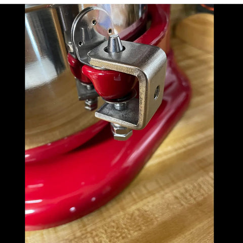 Close-up of a 1-inch stainless steel C-clamp with wide jaw mounted on a red woodworking stand