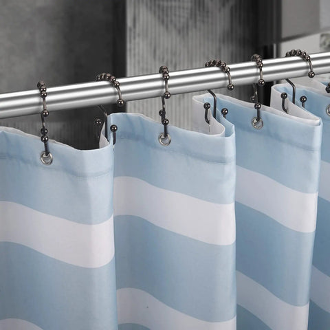 Rust Resistant Double Glide Shower Curtain Hooks Set Of 12 In Bronze Finish on a silver rod holding blue striped curtain