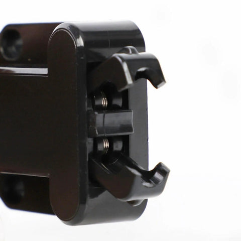 Close-up of push to open cabinet latch with touch release, no-handle push lock, black finish, part of 4 pack modern minimalist hardware
