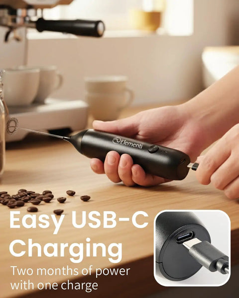 Person holding rechargeable milk frother wand USB-C handheld drink mixer for home barista vibes, fast foam in 15-20 seconds.