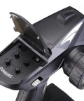 Close-up of the X4 4CH RC Radio System Transmitter for Cars Boats Tanks, showing control knobs and battery compartment.