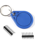 Blue key ring and pin headers from 5Pcs RFID Kit With Mifare RC522 Reader Module For Development Projects, RF IC Card Sensor Module, S50 White Cards And Key Ring Included, Plug And Play DIY Starter Set For Arduino And Raspberry Pi.