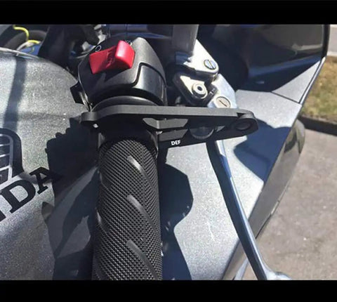 Universal Motorcycle Cruise Control With Aluminum Wrist Grip Lock Clamp And Silicone Ring Protector mounted on handlebar