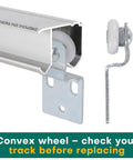Four Pair Sliding Closet Door Roller Kit For Top Hung Doors With Three Quarters Inch Convex Wheels Ball Bearing Stamped Steel Rollers And Front Panel One Quarter Inch Offset And Rear Panel Three Eighths Inch Offset Brackets displayed with convex wheels in metal track, close-up view.
