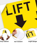 Lift Here label decal, 5x2 in, bright yellow with black down arrows, vinyl, 10-pack