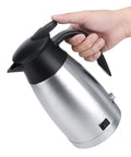 Zero Drama Portable Electric Kettle Made From Solid Stainless Steel With Kickin Quick Boil And Safe Auto Shut Off in a hand.