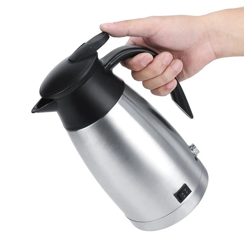 Zero Drama Portable Electric Kettle Made From Solid Stainless Steel With Kickin Quick Boil And Safe Auto Shut Off, held in hand.