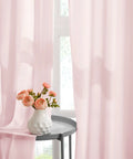 Privacy Semi Sheer Curtains Light Pink 84 Inch Long 2 Panel Set W52 X L84 Light Filtering Drapes hanging with flowers nearby.
