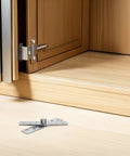 Invisible Pivot Door Hinges Set 360 Degree Rotation Stainless Steel Concealed Heavy Duty Secret Door Hardware For Wood Cabinets And Hidden Bookcases 6 Pack shown on floor near cabinet