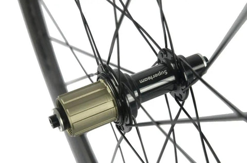 Close-up of a hub on the Beast 50mm Carbon Basalt Braking Surface Clincher Road Wheelset 700c with Matte 3k Finish Toray T700 Fibers.