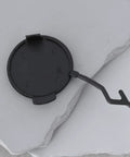Right Side Tow Hook Eye Cover Cap For Porsche Cayenne 2011 To 2014 Rear Bumper Replacement 95850545000 shown on stone surface
