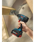 Compact 18V One Quarter Inch Hex Impact Driver Bare Tool With Built In LED Light in use on wooden structure