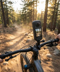 Cyclist using X4 Air 360 Action Camera With Lightweight Dual Lens Waterproof 8K Stabilization For Travel Cycling Snorkeling Vlogging And Outdoor Sports Plus 50 In 1 Accessory Kit And More on forest trail