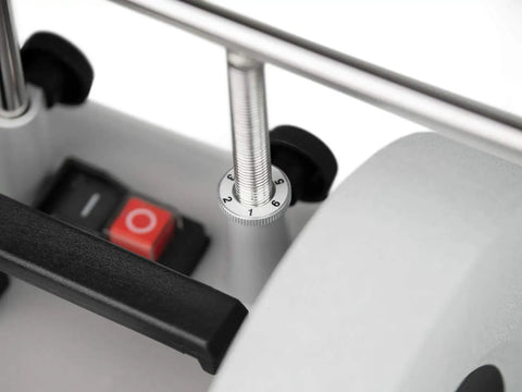 Close-up of Top Shelf Water Cooled Sharpening System's adjustment dial and power switch for precise sharpening.