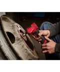 Pro Grade Heavy Hitter Brushless Right Angle Die Grinder With Four Speed Settings And Variable Trigger Plus Built In LED Light Compact M12 Platform compatible, used for polishing a metal wheel.