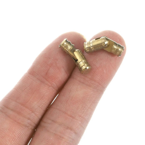 Slick Invisible Brass Barrel Hinges 24 Pack 5X17mm Concealed Woodcraft Hardware For Jewelry Boxes shown in hand.