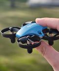 Person holding Mini Drone For Kids And Beginners With 3 Batteries, Indoor RC Quadcopter, 3D Flips, 360 Rotations, blue color