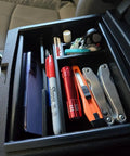 Toyota Tacoma Center Console Organizer Tray For 2024-2026 Models with phone, pen, flashlight, keys, and multitool stored neatly.
