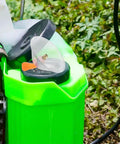 6-Piece Agricultural Spray Nozzle Set For Electric Farm Sprayer With Windproof Shield placed atop a green container in a field