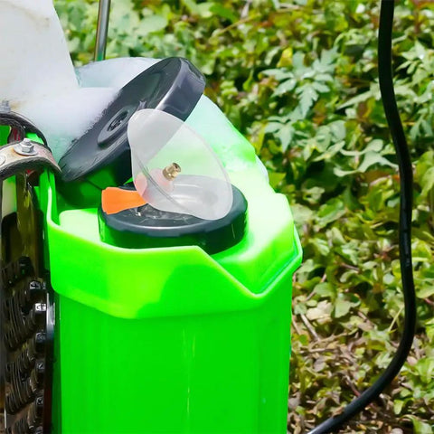 6-Piece Agricultural Spray Nozzle Set For Electric Farm Sprayer With Windproof Shield placed atop a green container in a field