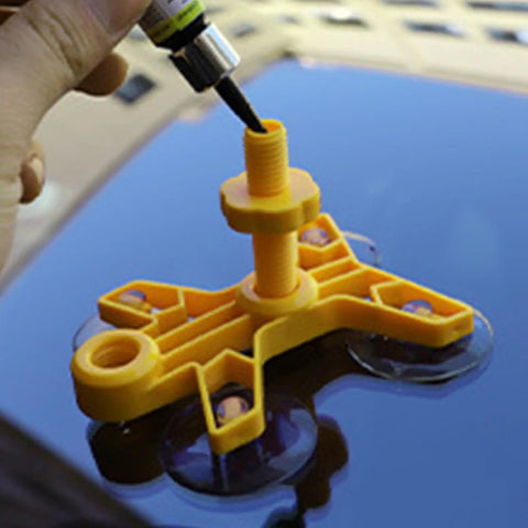 Close-up of Windshield Crack Repair Kit for Cars in use on auto glass, showing resin application with yellow applicator base.