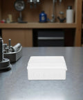 Cool 13 Piece I P65 Waterproof Junction Box Kit For Electrical Projects, white plastic enclosure on a workbench.