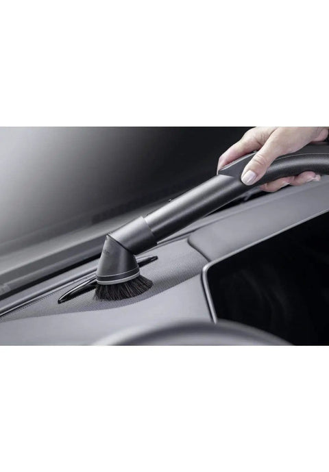 Using the Attachable Dusting Brush For Vacuum Cleaners With Flexible Swivel Joint Pro Grade Furniture Care on a car dashboard