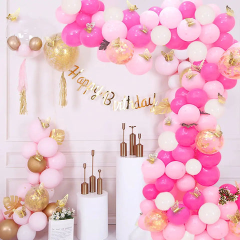 Party decor with balloons and 72 Pcs Gold Butterfly Decorations Set With Three Sizes And Three Styles 3D Wall Decor shining on wall.
