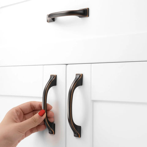 Oil Rubbed Bronze Cabinet Pulls 3 Inch 76mm 10 Pack Brushed Bronze Handles installed on white kitchen drawers