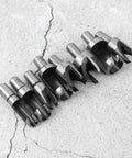 Eight piece Straight Shooter Wood Plug Cutter Drill Bit Set Built Different Using Hardcore High Carbon Steel on concrete.