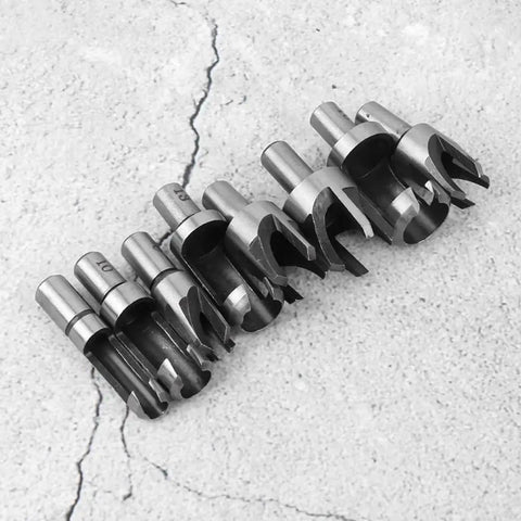 Eight piece Straight Shooter Wood Plug Cutter Drill Bit Set Built Different Using Hardcore High Carbon Steel on concrete.