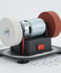 Pro Grade Dual Wheel Electric Bench Grinder with white polishing and red grinding wheels for metal projects.