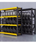 Heavy Duty Metal Garage Shelving Units That Are Built Tough For Warehouse And Home Use Height Adjustable Steel Storage Racks With Thick Beams Maxing Out Massive Loads Yellow storing tires and wheels.