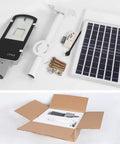 JUDYSSY 100W Solar Street Light with components including solar panel, remote, aluminum light, and installation parts in packaging.