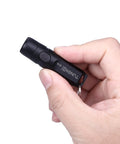 Hand holding Rechargeable Keychain Flashlight 650 Lumens EDC Pocket Light Tiny Yet Mighty Must Have Camping And Outdoors Fast USB C Charging
