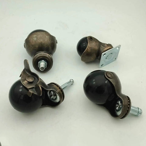 Solid Brass Ball Caster Wheels With Tight Locking Brake Four Pack Heavy Duty Polyurethane Rubber Treads for smooth rolling.
