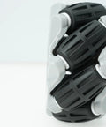 Close-up view of 60Mm Mecanum Omni Wheels For DIY Robot Builds All Direction Drive Wheel Set showing ABS rubber in gray and black.