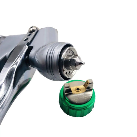 Close-up of Pro Grade Mini Pneumatic HVLP Paint Spray Gun With 1.2mm Tip showing nozzle and air cap for automotive precision.