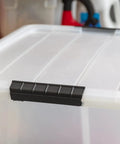 Close-up of 60 Quart Plastic Storage Box With Secure Buckles And Pull Out Design For Home Organization Pearl White Stackable Container