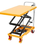 Front view of a yellow hydraulic lift table cart with black scissor mechanism and four red wheels.