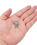 Hand holding 50 PCS 1.6Mm By 6Mm Stainless Steel Dowel Pins Kit For Shelves And Fasteners Silver Finish Durable Corrosion Resistant Hardware