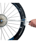TW 2.2 Torque Wrench 0-60 Nm 3/8 Inch Drive for Bike Maintenance adjusting a bike wheel component with precision.