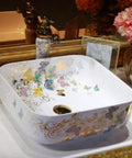 Top Shelf Handmade Ceramic Bathroom Sink Featuring A Super Sleek Butterfly Design, square basin, decorative floral patterns.
