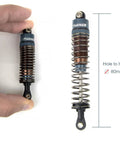 Close-up of 80mm RC Oil Filled Shock Absorber Kit for 1/10 scale crawlers, showing CNC aluminum body and threaded preload, grey.