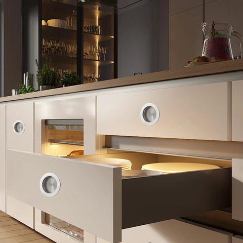 Recessed Pocket Door Pull Handles 2 3 4 Inch Round Finger Flush Pulls installed on modern kitchen cabinets, brushed 304 stainless steel.