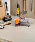 MAGICLULU High Torque Electric Mini Belt Sander With Efficient Heat Dissipation Compact Grinding Machine for jewelry polishing on a workbench.